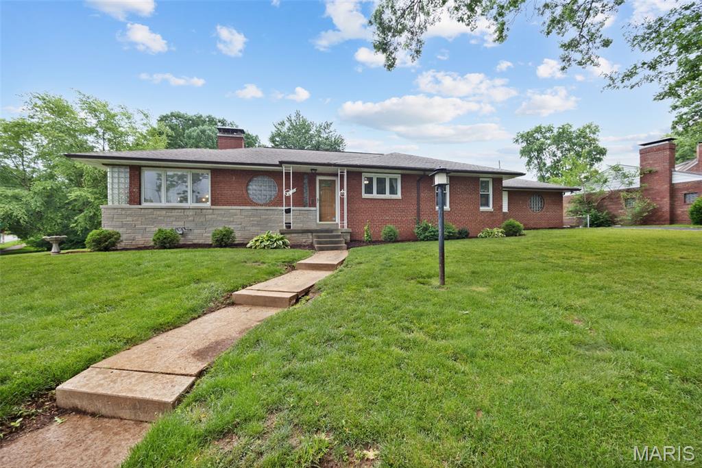 Rare find in Holly Hills. You will fall in love with this sprawling ranch filled with natural light on an amazing lot with fenced-in back yard and park views. There is plenty of storage with large closets in each bedroom, 3 additional closets in hallways, built in storage in the basement – you’d be hard pressed to find more storage in the city. Large kitchen with tons of counter and cabinet space plus 2 pantries. The lower level offers additional space to spread out and make your own. You will be blown away by the outdoor entertaining area featuring two patios (one covered) that run the length of the back of the house with views of River Des Peres Greenway, Joe Leisure Park, close to Carondelet Park and many great dining options. Need parking...the corner lot and wrap around driveway assures you will never need to parallel park at your home again. Pella windows with built in blinds throughout the main level plus hardwood floors. Act fast when they look like this in this desired area.