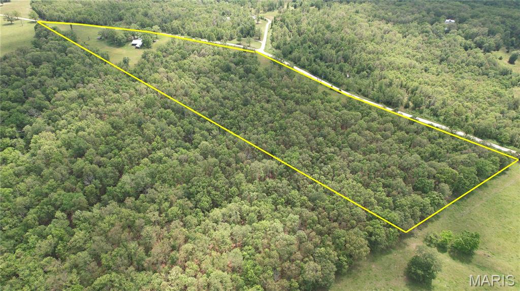 Looking for the perfect 30 acre farm? Perfect for hunting or running livestock, this 30 acre farm offers land 1/4 open with balance in mature timber. House/cabin is 1,171, 2 bedrooms, 2 bath, with baseboard, wood heat, and propane wall heat. Also 2 car awning, 48x24 concrete floor workshop with huge shed roofs offer abundant parking of equipment and tools. The land lays long with the road, perfect for dividing. See today!