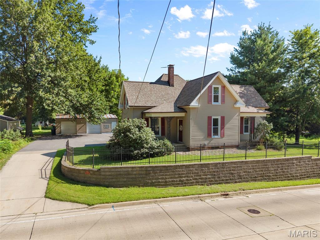 Welcome home to this charming 3-bedroom, 2-bath residence situated on nearly 1 acre in the desirable Edwardsville school district! Inside, you'll find a spacious kitchen with abundant cabinetry that flows into a large dining room, creating the perfect space for everyday meals and entertaining family and friends. The living room provides a warm & inviting space for relaxing. There is one bedroom & a full bathroom on the main level. Upstairs, the private primary suite serves as a relaxing retreat, featuring a beautifully remodeled en-suite bathroom complete with a custom tile walk-in shower. The second bedroom upstairs boasts a custom closet organization system adding to this functional space. 

Outside, the oversized detached 2-car garage & shed offer exceptional space for vehicles, storage, hobbies, or a workshop, while the expansive lot provides endless possibilities for outdoor living, gardening & recreation. Enjoy outdoor living on the spacious patio with a pergola just off the rear deck. Conveniently located near shopping, dining, parks, schools, and major highways, this property combines the space you've been searching for with the convenience of an ideal location. Don't miss the opportunity to make this Glen Carbon gem your own!