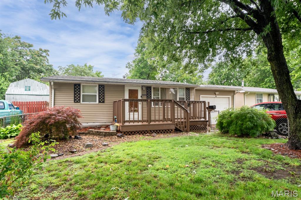 3 bed, 1 bath ranch featuring a spacious living room, kitchen/dining combo, attached garage, and large deck perfect for entertaining. Enjoy the fenced backyard with mature shade trees and a storage shed offering additional space for tools and equipment. Great opportunity for first-time buyers, downsizers, or investors. Convenient layout with comfortable living spaces inside and plenty of room to enjoy outdoors. This home is also outside of City limits. Schedule your showing today!