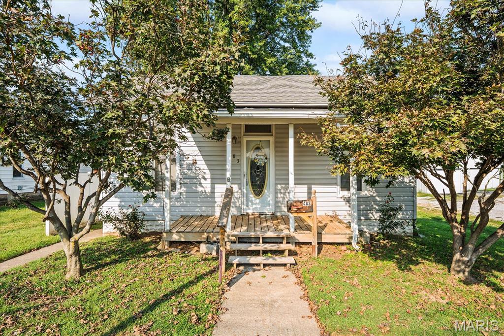 This ranch home in the heart of Nashville has a large living room with a fireplace, a large laundry closet with both washer and dryer to stay, a bonus room great for a dining room or office, eat in kitchen with appliances to stay, and two bedrooms that share a full bath.  The back yard has a shed and carport for your storage needs along with a partial basement/cellar.  A little tlc will go a long way!