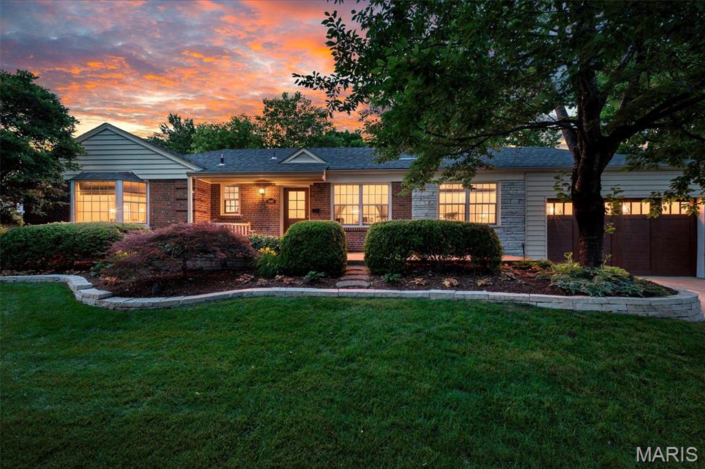 Tucked into one of St. Louis’ most beloved neighborhoods, this stunning St. Louis Hills ranch is the kind of home people wait years for. From the moment you pull up, the timeless mid century brick curb appeal, lush professional landscaping, and commanding presence make it clear this one is special. Situated on an extraordinary .33 acre lot, the setting feels more like a private resort than city living. Inside, nearly 2,300 square feet of beautifully maintained living space unfolds with warmth, character, and thoughtful updates throughout. The newer kitchen is exceptionally well appointed with quartz counters, undermount cabinet lighting, soft close cabinetry, pantry storage, breakfast area, and finishes that strike the perfect balance between style and function. The dining room is an absolute showstopper, wrapped in windows and overlooking the spectacular backyard oasis. Whether hosting holidays, dinner parties, or a quiet morning coffee, the views of the expansive patio, gorgeous landscaping, and incredible 8' deep pool steal the show from every angle. The finished lower level adds incredible flexibility with a sizable family room, second full bathroom, and additional sleeping area perfect for guests, hobbies, office space, or movie nights. Brand new roof for added peace of mind. And then there is the lifestyle. Living in St. Louis Hills means evening walks past some of the most amazing architecture, summer bike rides to Francis Park, neighborhood block parties, and easy access to some of the city’s favorite local spots like Ted Drewes, LeGrand’s, Mom’s Deli, Rockwell Beer Garden, and so much more. It is one of those neighborhoods where people know their neighbors, holiday traditions run deep, and pride of ownership shines on every street. Beautiful homes come along all the time. Homes with this level of care, this lot size, this outdoor experience, and this location rarely do.