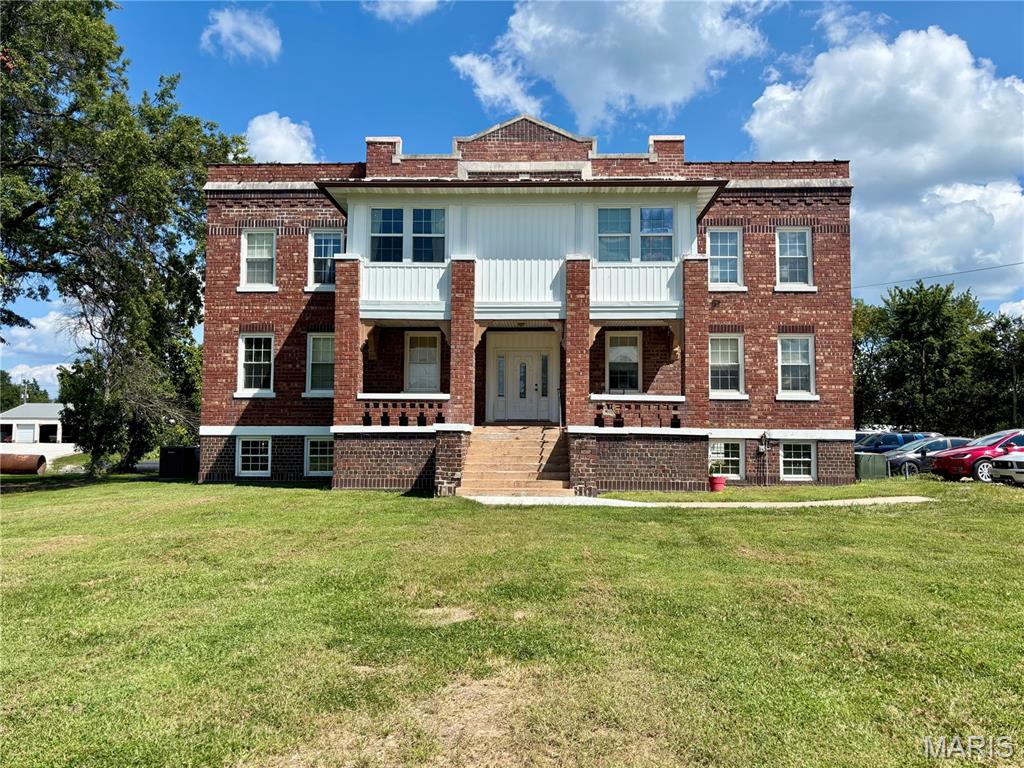 Opportunity for investors! 6000+ sq ft brick 3 story building refurbished in 2013 into 4 apartments with room to add more in the bottom level. Currently rented, 2 bedroom apartments. Duplex behind units with one side unfinished to use. Large lot for possible additional expansion. Lower level is ready for your design. 2013 the Windows were replaced with new vinyl windows, new plumbing electricity, high efficiency HVAC heat pump systems some hard surface flooring, wood cabinetry, appliances. Roof Coated 2022. Sitting on six lots!