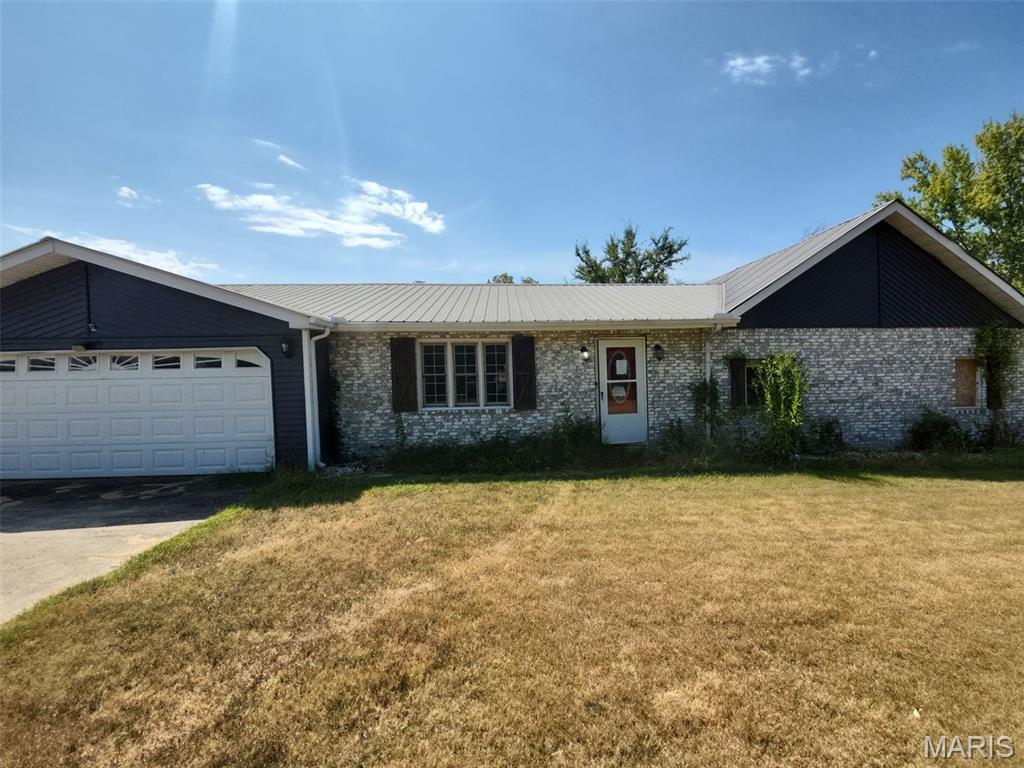 Country living at the very best! Ranch home, and 4 acres! Living room, kitchen/dining, 3 bedrooms and 3 bathrooms. Living area with approximately 1,766 sq. ft. of space. Other section of the home is ready for a handyman's touch. Attached with a 2-car garage and 1-carpot. Full basement gives spare space for storage.