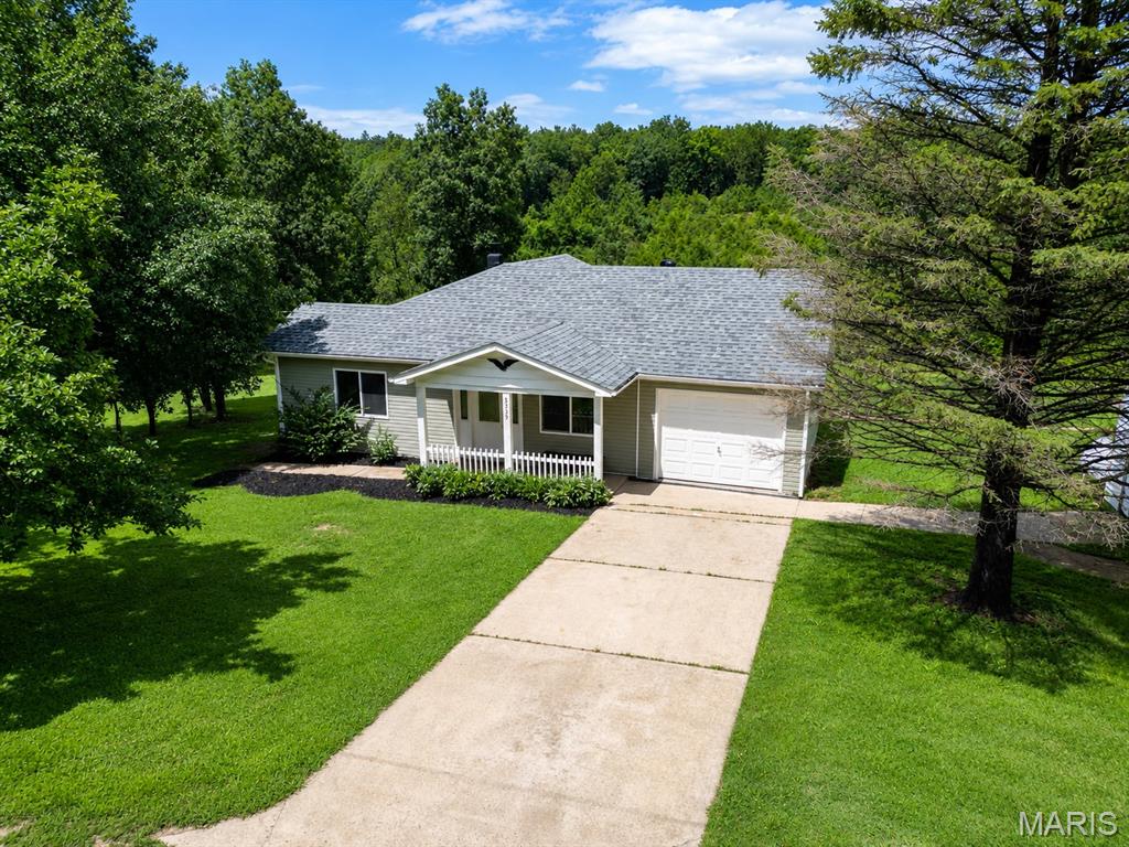 Escape to your own private retreat on nearly 9 acres! Tucked away in the hills of French Village, this updated 2-bedroom, 2-bath home offers modern comfort surrounded by the peace and beauty of nature. Large windows fill the home with abundant natural light, creating a bright, inviting atmosphere throughout. The partially finished basement provides additional living space with room to expand or customize to fit your needs.

Set on 8.96 acres of highly usable ground, this property is a rare opportunity for those seeking privacy, recreation, or a country lifestyle. Fruit trees are scattered throughout the property, while deer, turkey, and other wildlife are frequent visitors, making every day feel like a retreat.

Outside, you'll find multiple outbuildings, including a large detached garage and a spacious pole barn with tremendous potential. While the pole barn could benefit from some repairs, it offers an excellent opportunity to restore it into a functional workshop, equipment barn, or storage building.

If you've been searching for true seclusion, this is it. The property is accessed by rugged roads, and while four-wheel drive is recommended—particularly during wet conditions—a two-wheel-drive pickup has accessed the property successfully under normal conditions.

Whether you're looking for a full-time residence, a weekend getaway, hunting property, hobby farm, or simply a place where peace and quiet still exist, 5315 Lynam Road delivers a lifestyle that's becoming increasingly difficult to find.