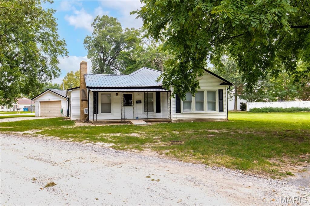 Looking for a great starter home in an excellent neighborhood!?  Here is is!  This home sits on a corner lot with access to Lombardy and also to Millar Rd.  When you enter the home you will notice a spacious living area with a fireplace.  This leads into a dining room right off the kitchen and a second living space.  The kitchen has lots of cabinets and counter space if you love to cook. The home is a spacious 2 bedroom 1 bath but could be made into 3 bedroom. This home has the ability to be turned into a 3 bedroom if need be.  This home also sits on a half acre lot so plenty of room for all outdoor activities!  There is also a detached garage with 2 storage rooms in it.  Schedule your showing today!!