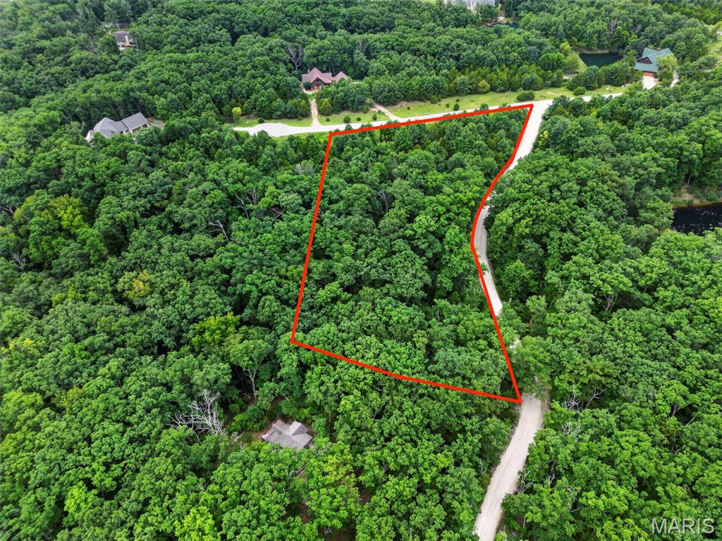 Start your Innsbrook lifestyle now**! This gorgeous 3-acre private lot is situated inside Innsbrook Resort and offers plenty of level land to build your custom dream home, including the potential for a walkout lower level. A beautiful mix of mature hardwood trees creates privacy and a peaceful wooded setting, while the elevated location offers beautiful views of the valley below. Enjoy abundant wildlife, nearby hiking trails, paved roads, and the incredible convenience of being within walking distance of Kitzbuhl Beach.

Very few opportunities remain to own a 3-acre homesite in Innsbrook, making this a special opportunity for someone looking for space, privacy, and a beautiful natural setting.
And you don't have to wait to enjoy it! Upon purchasing the property, you can begin enjoying all that Innsbrook has to offer before you ever build. Take advantage of the lakes, beaches, hiking, golf, pools, fitness center, events, and recreational amenities while you take your time planning your future home.
No required timeframe to build** — build when you're ready and enjoy Innsbrook from day one.