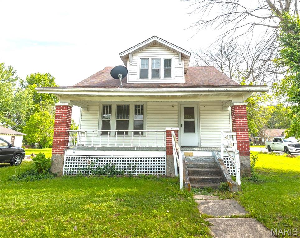 Step into another era with this beautifully preserved 2-bedroom, 2-bath historic home in the heart of Belle, MO. Built in 1930, this two-story home blends timeless character with meaningful updates, including improved electrical wiring and plumbing—giving you peace of mind while still allowing room to make it your own. Inside, you’ll find high ceilings, wood flooring, and unique vintage touches that truly set this home apart—from the classic clawfoot tub to the retro Kenmore stove and eye-catching vintage light fixtures. The layout offers flexibility, with a bedroom and full bath on the main and upper level, along with a cozy sitting room or office space—perfect for quiet mornings or working from home. The home is just unfinished enough to invite your personal style and finishing touches, making it a great opportunity for someone who appreciates character and wants to add their own vision. Situated on a corner lot right in the center of Belle, you’ll love the convenience of being just steps away from local shops, restaurants, and everyday amenities. If you’ve been searching for a home with soul, history, and potential—this one is ready to welcome you in. Schedule your showing today!