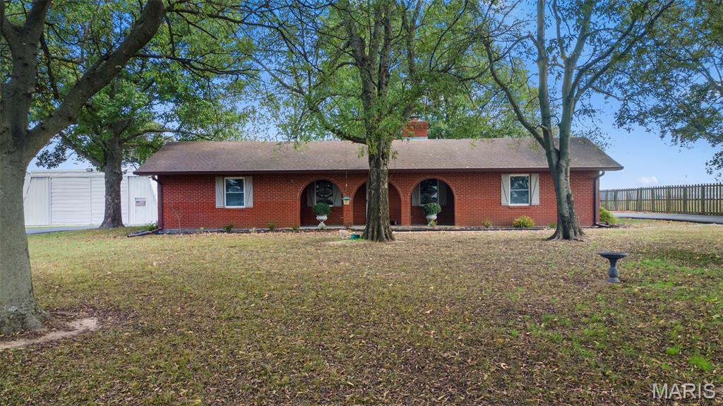 Looking for space, style, and function all in one? This brick home delivers. With 3 bedrooms, 2 full baths, and an open floor plan featuring a split-bedroom layout, it's designed for easy, comfortable living. The finishes make it truly move-in ready, while the layout offers both flow and privacy. Outside you'll find just over an acre of fenced ground, a circle drive, and a 2 car attached garage. The large shop adds room for projects, storage, or hobbies and the built-in storm shelter provides peace of mind. Perfectly positioned close to both Cape Girardeau and Sikeston, this home offers the space you want with the convenience you need.