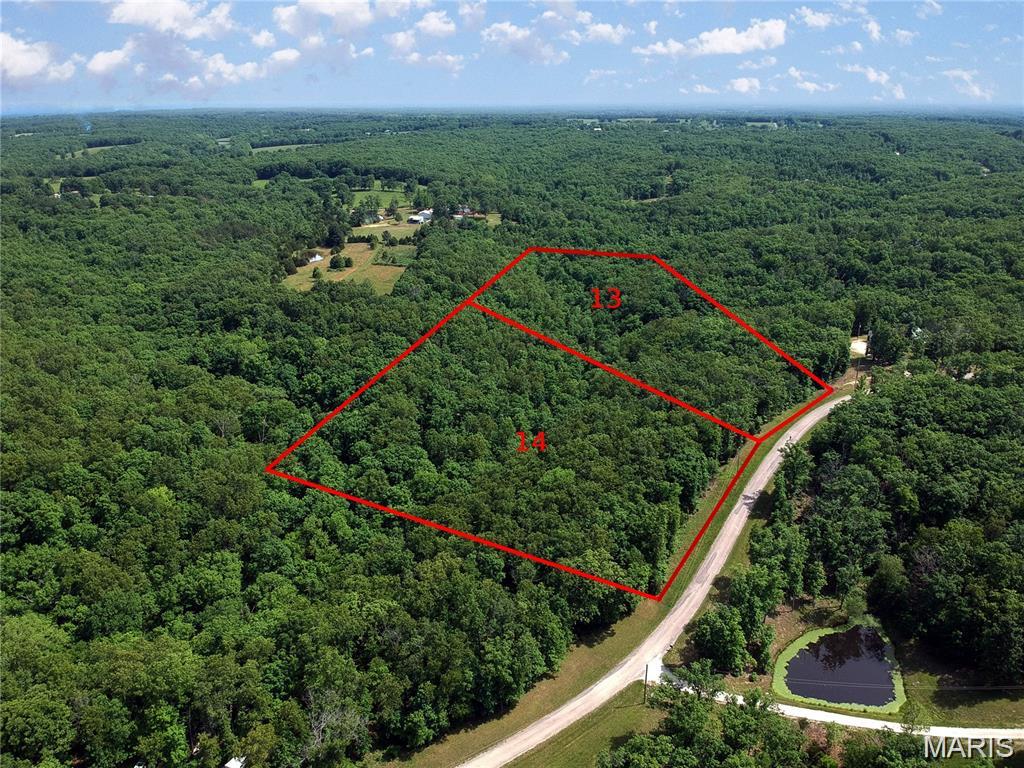 Lot 13 in the Hickory Ridge community offers an opportunity to own 8 acres of primarily wooded land in a peaceful, natural setting. With mature trees and a wet weather creek running through the property, this land is ideal for anyone looking to build a home surrounded by nature or establish a private weekend retreat. The land provides potential building sites, and with electricity nearby and fiber optic internet available, it’s ready for development without sacrificing modern conveniences. Located just a short drive from I-44, the property offers easy access to town while still maintaining a sense of seclusion. Outdoor enthusiasts will appreciate the proximity to the Meramec River and numerous nearby trails, making this a perfect spot for those who enjoy hiking, fishing, kayaking, or simply relaxing in the quiet beauty of the Ozarks. If you're looking for a peaceful place to call home, this 8 acre parcel in Hickory Ridge has the versatility and charm to meet your needs.