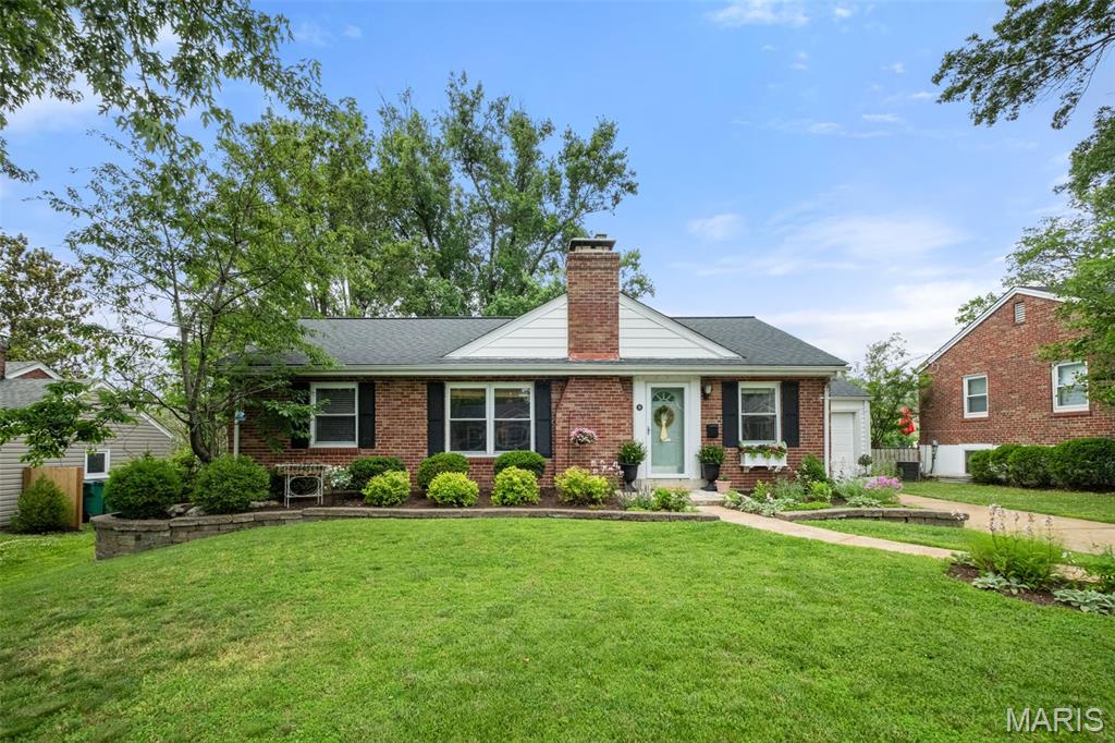 Welcome home to 14 West Rose Avenue ... a delightful 3 bed, 2 bath brick ranch that perfectly captures the lifestyle of Webster Groves. The lush landscaping that surrounds the home will get your attention as soon as you arrive and, as you enter, you'll immediately love the hardwood floors and the flowing and light layout that provides a bright, welcoming vibe. Step into the living room with fireplace that leads to the dining room and then the kitchen overlooking the back yard. From here, head down to the mostly finished lower level with rec room, wet bar, full bath, laundry room, and plenty of storage. The three bedrooms and a hall bath complete the main level. The back door from the kitchen leads to the attached garage and the covered porch and aggregate patio in the level, fenced yard. Situated in the coveted Webster Groves School District and minutes from the vibrant shopping and dining on both Big Bend and Lockwood. Don't miss this perfect blend of comfort, character, and unbeatable location!