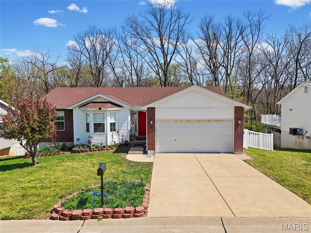 You have to see this one!  Enter this 3-bedroom, 2-bath home via the entry foyer in High Ridge that is ready for new owners.  Spacious and open with a vaulted ceiling, new plank flooring throughout, new HVAC, and more. The large kitchen offers updated granite countertops, large breakfast bar, lots of cabinet space, and tons of counter space, new stainless steel range with smooth cooktop, dishwasher, and microwave in 2022. (fridge not included). The main floor laundry room is off the kitchen. The large living room features a vaulted ceiling, newer vinyl plank flooring, and a wood-burning fireplace with built-in shelving. But the real gem is the large, private composite deck, which includes solar-powered deck lighting, overlooks the private, beautiful yard, features new railings, and has extra-wide steps to the landscaped yard. Under the deck is an additional composite deck area patio for added space in the shade.  The primary bedroom is spacious and features a private full bath, a soaking tub with shower doors, and a large closet. Bedroom 2 has a bow window for added square footage. Both bedrooms 2 and 3 are off a separate hallway, with a full bath with a tub. The lower level is unfinished, walk-out with 220 service. The sliding glass door opens to a beautiful, fenced, and private yard and under-deck. New furnace/ac in 2024, new roof in 2017. The oversized 2-car garage has 'MyQ' garage door system. Security cameras cover the front, back, and doorbell with motion detection.  Front and back yard, including solar panel lighting. Lots of updates and improvements. Great neighborhood on private street. Northwest School District, close to shopping, entertainment, and easy access to Hwy. 30, 141, or 270. This home is a must-see.  OPEN HOUSE SATURDAY 11 -1 PM (4/11/26)  More interior photos by 4/10