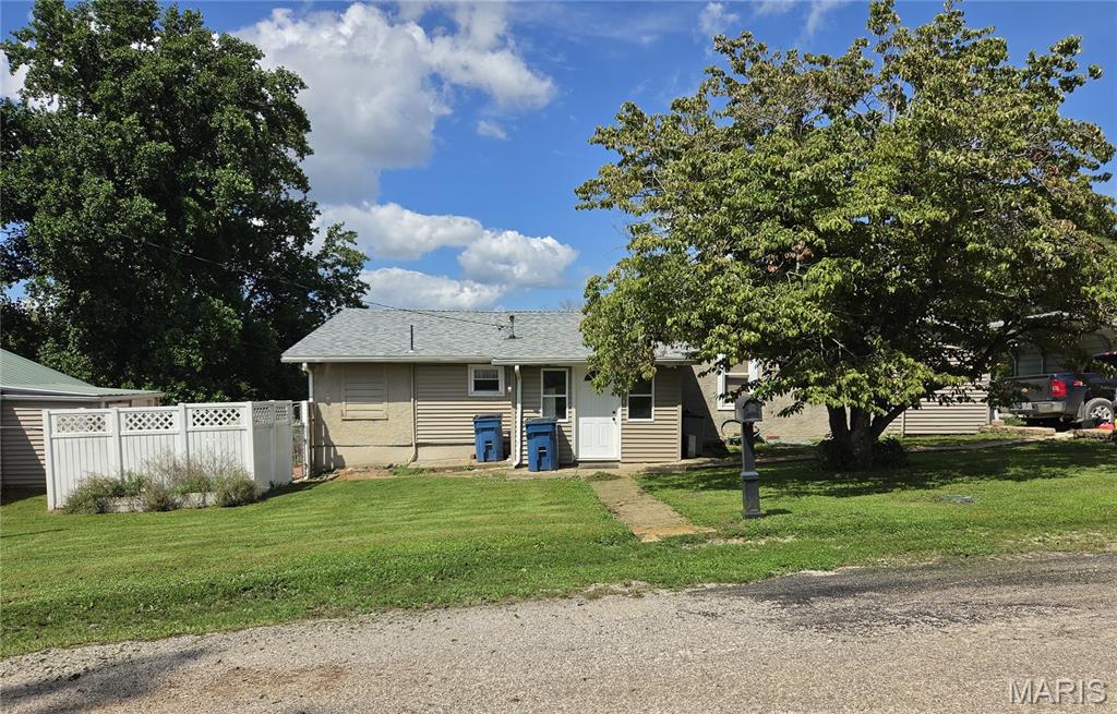 Two homes for the price of one. Property is improved with two 1-story residential dwellings. 801 N 3rd is a 2 bed / 2 bath having newer Hickory kitchen cabinets; large living / dining area with electric fireplace and walkout to patio; family room with walkout to 2-tiered deck and greenhouse; walk-in closets in each bedroom; laundry hook-up in 2nd bath; partial basement; 8x12 enclosed porch; extra insulation added above living, dining and kitchen areas; updated furnace and electric; and new roof, central air, and water heater all within the past 5 years. 803 N 3rd is a 1 bed / 1 bath renting at $400/mo, and is of concrete block construction with slab foundation, and contains approximately 821 square feet having vinyl siding; new metal roof, electric water heater, and furnace all within the past 4-5 years; laundry hook-up; and covered porch. Property also has a 22x38 detached garage with shop. Kitchen microwave at 801 N 3rd, stove, refrigerator, and window air unit at 803 N 3rd, and metal shed, greenhouse, and dog kennel all convey. All other appliances, pellet stove in living area at 801 N 3rd, and red barn-style shed and windmill do not convey. Carport negotiable.