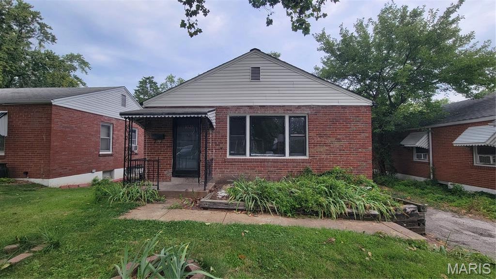 OUTSTANDING OPPORTUNITY!!! This U-City bungalow is sure to please!  SO much potential here!  4th legal bedroom UPSTAIRS with ease! All brick exterior, hardwood floors and MORE!  Fenced yard, off-street parking and updated electric panel makes this one a WINNER! Bring your work boots and make it shine once again!  Schedule a showing today! Property is to be sold in its current as-is condition with no warranties or representations by the Seller. Seller will not make repairs nor provide any inspections. Seller's addendum is required after terms of sale are agreed upon. Special Sale Contract (Form #2043) required. Proof of funds or pre-approval letter required with offer.