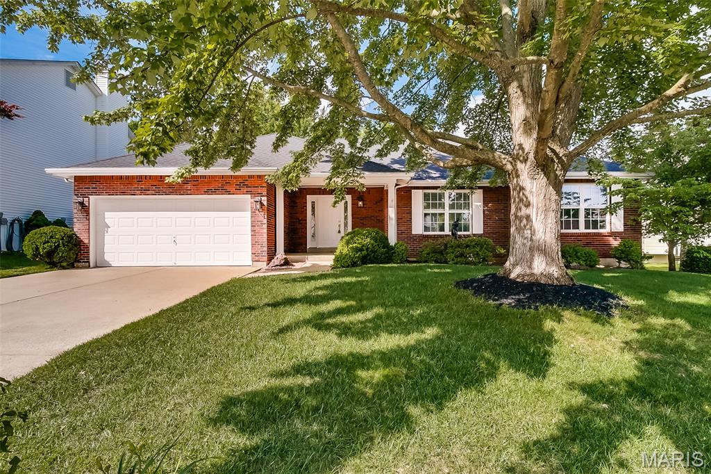 Meticulous 3-bedroom, 3-bathroom home in St. Peters!  This home has it all! Features include fresh paint and carpeting throughout the main and lower levels!  The main level boasts a large family with vaulted ceilings, updated kitchen featuring hardwood flooring and pantry, laundry room and 3 bedrooms.  The master bedroom suite features a large walk-in closet, and the master bathroom features separate tub and shower and double sinks!  The finished lower level features a recreation room, an additional bonus room, full bathroom and ample sized storage area.  The fenced-in backyard boasts a gorgeous large deck, perfect for entertaining!  Conveniently located near Woodlands Sports Park in Country Crossing Manor, this one won't last long!