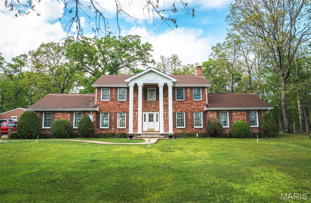 Welcome to this impressive 3,980 sq. ft. brick home, thoughtfully built with every detail in mind. This 5-bedroom, 4 ½-bath home offers a spacious layout perfect for comfortable living and hosting. The large kitchen is designed to be the heart of the home, with plenty of space for preparing meals and entertaining. Multiple dining rooms make it ideal for large family gatherings. Convenience is key with a main floor laundry, and the back patio is a perfect spot for outdoor gatherings and relaxation. The property includes an attached 2-car garage, plus a detached 2-car garage with cozy living quarters above, giving you plenty of extra space. For the horse lover, there’s a 3-stall horse barn, making this property perfect for hobby farm dreams. This is a beautiful home with endless possibilities!