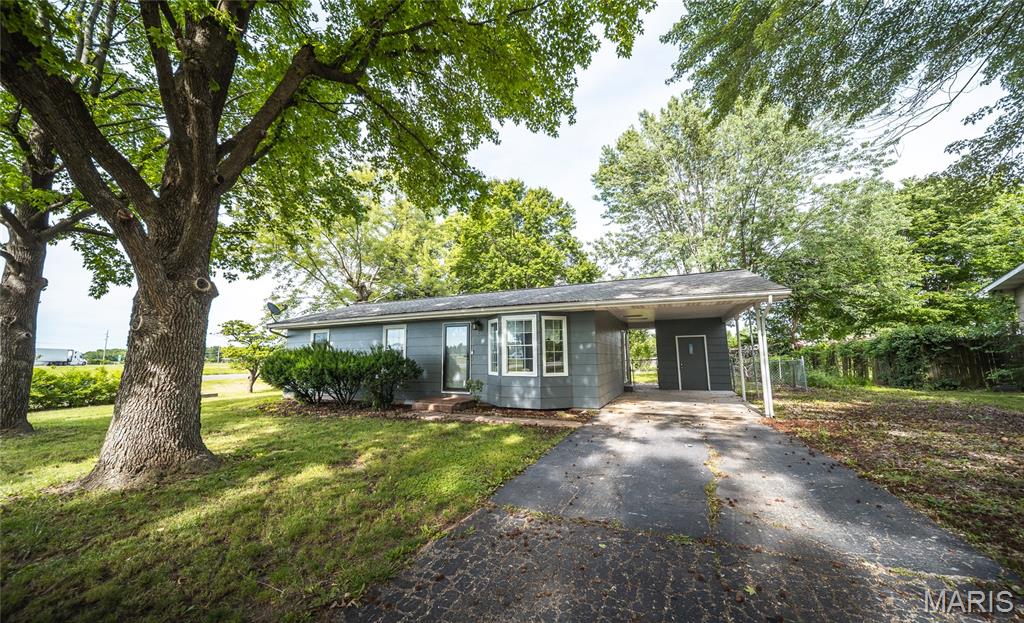 Welcome to 1 Marion Drive in St. James! This beautifully updated 3 bedroom, 2 full bath home offers a wonderful combination of comfort, charm, and functionality. The inviting living room features a beautiful bay window that fills the space with natural light and creates a warm, welcoming atmosphere.
The kitchen offers plenty of cabinet and storage space, making it both practical and functional for everyday living. 
The spacious primary bedroom provides plenty of room to relax and unwind, while the sunroom offers additional versatile living space perfect for morning coffee, a home office, or a cozy sitting area. Outside, the fenced in backyard provides plenty of room to entertain, let the dogs run or enjoy the outdoors. A storage shed offers convenient additional space for tools and lawn equipment. With its thoughtful updates, spacious living areas, and inviting outdoor space, this home is ready for you to make it your own!