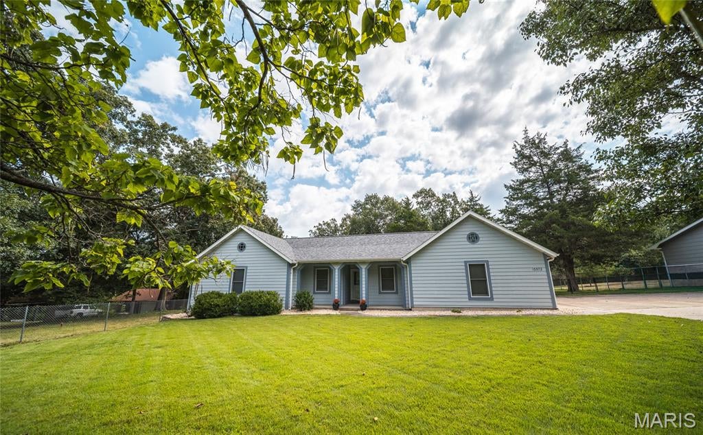 Welcome to a home filled with warmth, character, and everyday comfort in the heart of Rolla! This charming 3-bedroom, 2-bathroom home offers an inviting setting in a beautiful, established area while keeping you conveniently close to everything Rolla has to offer. Step inside to find a freshly painted interior that feels bright, clean, and ready for its next chapter. The wood-burning fireplace creates a cozy focal point for the living space—perfect for relaxing evenings at home or gathering with friends and family. One of the home's standout features is the sunroom, offering a wonderful space to enjoy your morning coffee, unwind with a good book, or simply take in views of the backyard throughout the seasons. Outside, the fenced-in yard provides plenty of room to enjoy the outdoors, whether you're gardening, entertaining, or spending a quiet afternoon at home. Two storage sheds offer additional space for lawn equipment, tools, hobbies, and seasonal items. A blacktop driveway leads to the spacious 2-car garage, providing convenient parking and even more storage. With its combination of character, functional living spaces, outdoor amenities, and a desirable location in the heart of Rolla, this home has so much to offer. Whether you're looking for your first home, your next home, or simply a place with a little extra charm, this property is worth seeing in person. Schedule your private showing today and come discover everything this Rolla home has to offer!