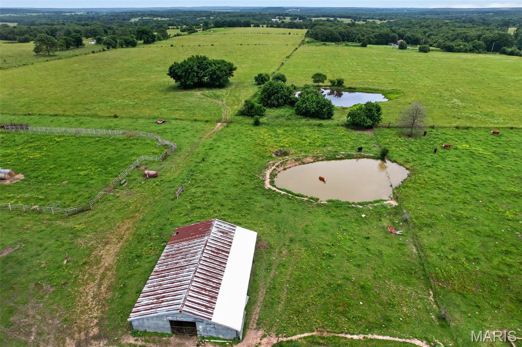 Discover the perfect blend of productivity and rural living with this exceptional 60-acre cattle farm in Stoutland. Conveniently located on a county-maintained road just off blacktop, just 15 minutes from I-44, this well-equipped property is ready for livestock, recreation, or your dream homestead.

The farm features quality perimeter and cross-fencing for efficient grazing management, multiple ponds providing reliable water sources, and a turkey barn along with additional outbuilding offering ample storage and operational flexibility. Utilities are already in place, including electric service, two private wells and water on site. Camper hookups add convenience for guests, seasonal use, or temporary living arrangements.

The property also includes a single-wide trailer that conveys with the sale and is of no additional value. Whether you're expanding an existing cattle operation, seeking a future homestead build site or looking for a versatile agricultural property with excellent access, this farm offers outstanding potential in the heart of the Missouri countryside.
