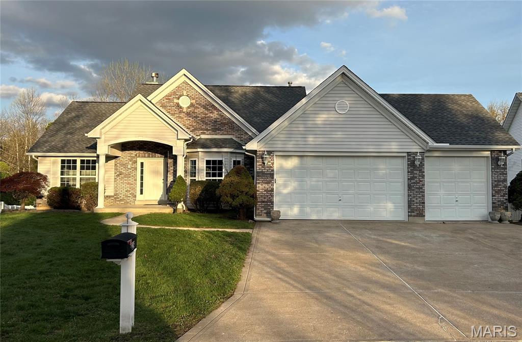 Welcome to this "one family owned" fantastic walk out ranch on beautiful Hidden Spring Drive.  This 4-bedroom, 3 full bath divided floorplan ranch checks all the boxes:  Curb appeal, 3 car extended garage,  main floor laundry, large rooms, open and bright, backs to trees, super convenient location.  The kitchen has plenty of counter/cabinet space.  Lower cabinetry features pull out shelving.  Breakfast room has plenty of room for larger table for entertaining or family meals.  There is also a separate dining room.  Great room has vaulted ceilings and a gas fireplace.  Primary bedroom is large, has vaulted ceilings, and a great view from the bay window.  On the opposite side of the main level are two additional generously sized bedrooms and full bath.  Down the bright open staircase, you enter the amazing lower level.  Huge family/recreation room, 4'th legal bedroom, plenty of egress windows and a walk out to the patio.  A full bathroom completes the finished area in lower level.  Unfinished area is just as impressive! Tons of storage area with adjustable built in shelving, and an oversized 2'nd door for easy access to backyard.  This home has great bones, amazing potential and is ready to become a "dream home" to another family.  Francis Howell Schools, easy access to 364, 94, 40, shopping, beautiful Veteran's Tribute Park, Kisker Library; this home has so much to offer, don't miss this one!