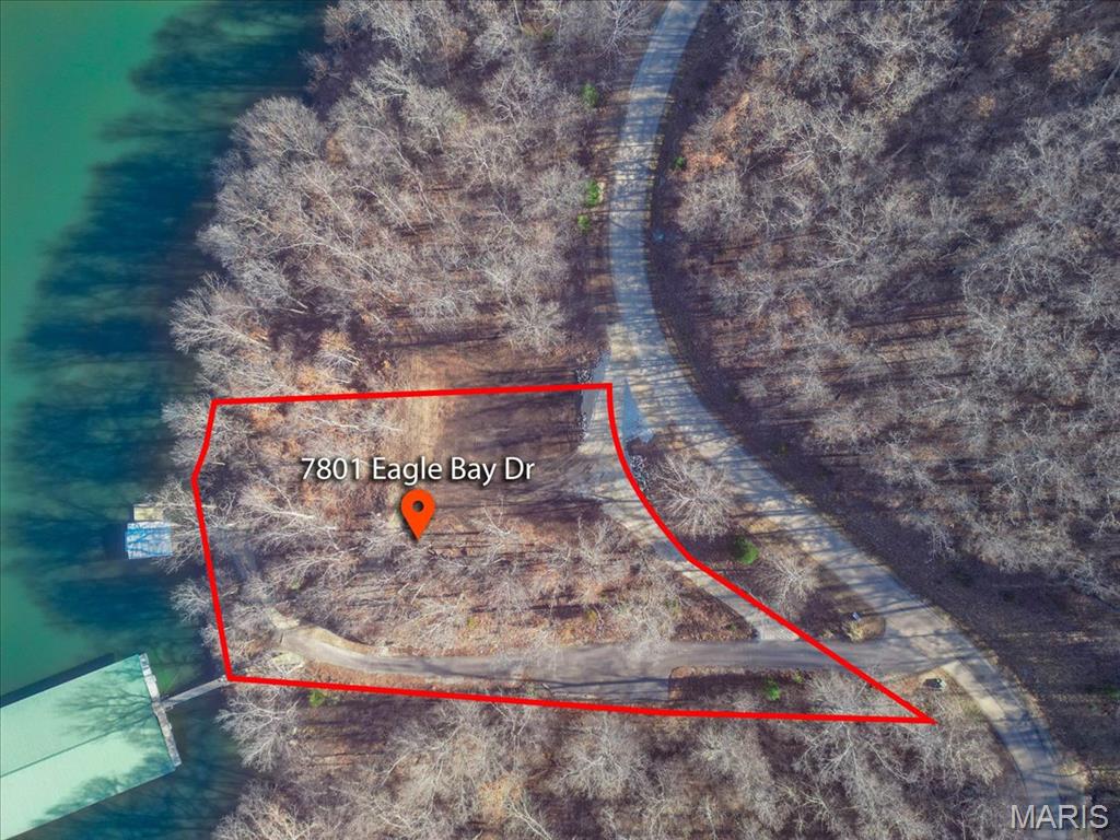 Prime 1.3-acre lakefront opportunity in prestigious Eagle Bay! This ready-to-build lot offers 226' of shoreline at the peaceful 55MM in Gravois Mills, combining privacy with quick access to waterfront restaurants, marinas, and town amenities. Professionally cleared and prepared for construction, this exceptional property is the perfect setting for your custom lakefront home or luxury retreat. Enjoy immediate access to the water with an existing wood dock featuring a 10x24 boat slip. Utilities are already available, including electric, water, sewer, and fiber internet, saving time and expense as you build. The gentle terrain and expansive 1.3-acre footprint provide endless possibilities for outdoor living, entertaining, and maximizing breathtaking lake views. Located in one of the Lake of the Ozarks' most desirable communities, this property offers the ideal blend of convenience, tranquility, and investment potential. Don't miss this rare chance to build exactly what you've envisioned. Schedule your private tour today and start living the lake lifestyle you've always wanted! Build now and enjoy lake life with space to create the custom retreat you've always imagined! Call now today!