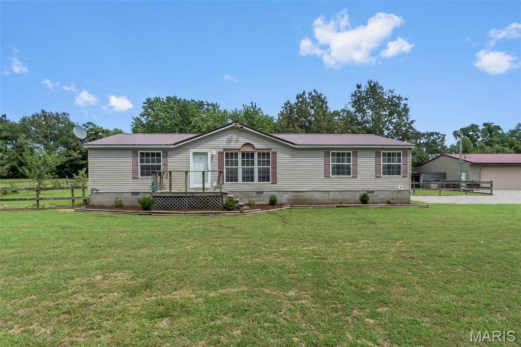 Welcome to 174 County Road in Oran! Situated on 4.8 acres just outside the Morley city limits, this 3-bedroom, 2-bath home offers the perfect combination of comfortable living and plenty of space to enjoy the outdoors. The entire property is fenced, providing added privacy and versatility. A standout feature is the large 3-car shop complete with an awning, additional parking in the back, and its own bathroom—perfect for vehicles, hobbies, storage, or a workspace. The property also features established fruit trees and blackberry vines, adding a touch of country charm. If you’ve been looking for acreage, a great shop, and room to spread out while still being close to town, this property is a must-see
