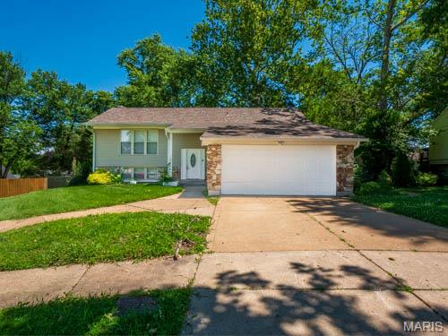 Impeccably maintained and ready for immediate occupancy, this stunning 5-bedroom split-level home offers an exceptional, affordable opportunity with abundant finished square footage. The bright, inviting upper level features a spacious living area that flows effortlessly into the kitchen, complete with sleek stainless steel appliances, ample cabinetry, and a layout perfect for daily living or entertaining. Three generously sized bedrooms and a two full bathrooms complete this level. Downstairs, the fully finished lower level maximizes your living space with two additional versatile bedrooms, a full bathroom, and a massive recreation room—ideal for a home theater, gym, or playroom. This turnkey property boasts numerous cosmetic and mechanical updates throughout, ensuring total peace of mind for the next owner. Step through the dining area to your private outdoor retreat, featuring a large deck that overlooks a fully fenced, expansive backyard. Complete with an attached 2-car garage and a fantastic location near local amenities, this rare find offers unbeatable space and value. Schedule your private tour today!