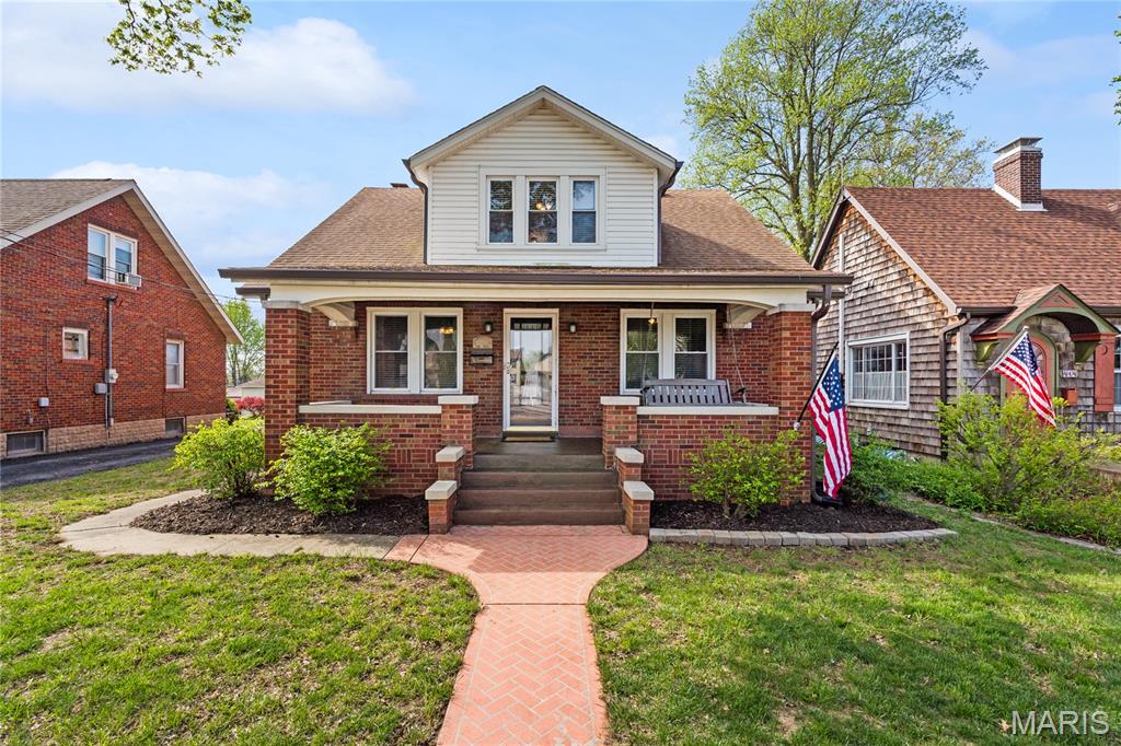 Welcome to 412 Park Street in Waterloo, where space, character, and updates come together in this amazing all-brick home! Offering 4 bedrooms with the potential for a 5th bedroom thanks to the bonus room upstairs, this well-maintained home provides plenty of room for a growing family. Step inside and appreciate the beautiful laminate flooring updated in 2017, along with the charming arched doorway between the living and dining rooms that adds timeless character. You’ll find spacious bedrooms throughout, large closet space, updated ceiling fans, and classic glass doorknob handles that add to the home’s charm. The main floor features 2 bedrooms and 1 full bath, while the upper level offers 2 additional bedrooms, a bonus room with no closet, and another full bath. One of the upstairs bedrooms could easily serve as a primary bedroom with its two oversized closets. The kitchen was remodeled in 2008 and features an abundance of fawn oak cabinetry, a lazy Susan, and includes all appliances: refrigerator (2023), microwave (2020), dishwasher (2019), double oven (2008), and cooktop (2008). Additional updates include double-hung windows replaced in 2008, roof in 2017, and new gutters in 2025. This home was previously set up as 2 units, so it offers the convenience of 2 furnaces and 2 A/C units, with an electric furnace in the upstairs attic installed in 2007 and the other furnace being gas. The lower-level basement provides excellent storage with shelving and tables that will remain, plus the deep freezer, washer, and dryer all stay. The dryer is currently electric, but a gas hookup is also available. There are 2 hot water heaters, with one currently in use and the second turned off but filled and basically brand new. The sump pump was replaced in 2017. Outside, enjoy the fenced backyard, a detached finished 2-car garage, and additional parking. This very well-maintained Waterloo home is simply waiting for its new owner—is it YOU?
