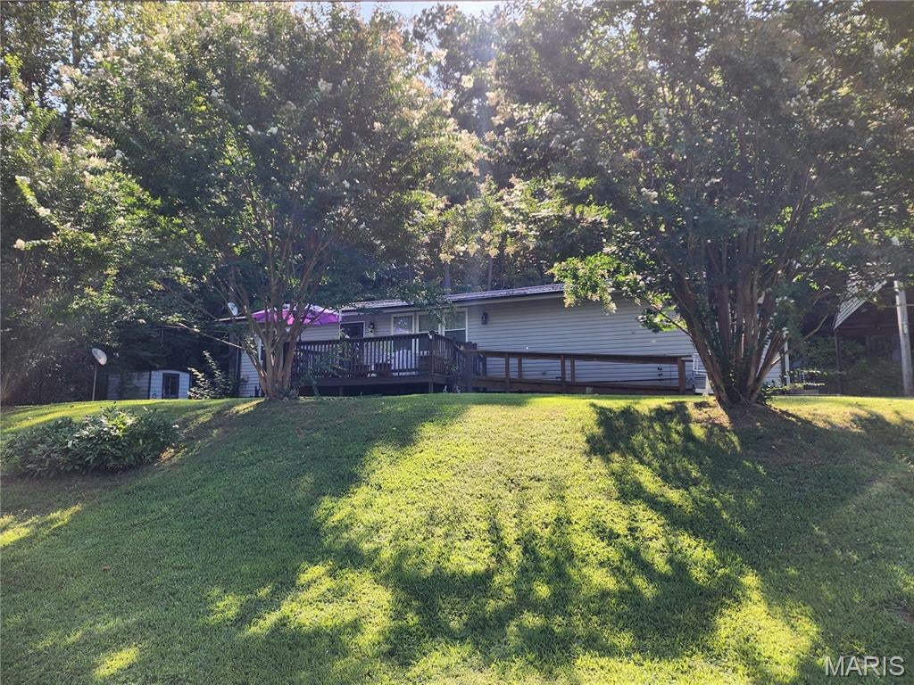 Been looking for a home near the lake?  You found one of the nicest ones in the area.  This three bedroom, two bath has been meticulously cared for and updated by the same family for the last 25+ years.  Features include 1688 SF of open concept living area with split bedroom format.  The master suite is HUGE!  We are talking 22X15 with a 22ft, walk in closet.  The kitchen was updated with beautiful, custom cabinets and corian countertops.  Bath updated with ceramic tile, soaking tub and separate shower.  The 12X12 sunroom offers a private getaway area on the back side of the home looking out at the wooded hillside or could be used as a 4th bedroom if needed.  Outside amenities include metal roof, 12X12 deck, 18X10 deck, 50 amp hookup for RV, firepit sitting area, a 26X26 carport with room for 3 vehicles.  Home is located very close to Clearwater lake, Black River, Sam A Baker state park, St Francis river and the rest of the Ozarks wonders.  Call today to schedule your private showing. Additional Rooms: Sun Room