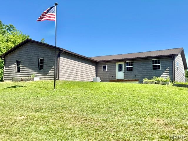 This 3 bed, 2 bath house was built with the full intention of being a forever home but, life has led the owners in a different direction. The floorplan is mostly open with a spacious living room, dining room and kitchen. The bedrooms are divided with the primary on the west side of the house and the others on the east side. Access the sunroom from the living room or the wrap around porch. It’s a great space to relax and enjoy the wildlife or cozy up with a book!  Home features: main level laundry, custom built cabinets, an enclosed area for the family pet with access to a chain link fenced in yard, large walk-in closet in the primary bedroom and a full basement ready for your own personal design. The covered porch is stamped, stained concrete. ICF construction with 9ft basement ceilings. Metal, log like siding. A 2-car attached garage. Tankless water heater. Manabloc water line system. Reverse osmosis water system. The basement has Epoxy finish on the floor and it’s been walled off for future living space as well as a being stubbed out for a full bath. Egress windows. Safe room complete with safe door. Walk out double door to a concrete patio area. The shop is 40x64 with attached covered drive through storage for the family toys! Camper, boat, side by side etc.  The shop is equipped with pex water lines in the concrete for a heated floor if you choose. It is also stubbed for a bathroom (no septic). Spray foam insulated! The smaller sheds are negotiable. There is so much potential at this property. You just need to come see all it has to offer.  Realtors, please read the agent remarks.