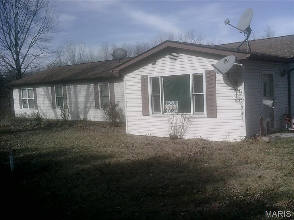 Large 3 bedroom 2 bathroom home on a one acre lot. Updates include newer well electrical system and newer electrical breaker box service. Additional amenities include a spacious 2 car detached garage, storage shed, and bonus office/workshop building.