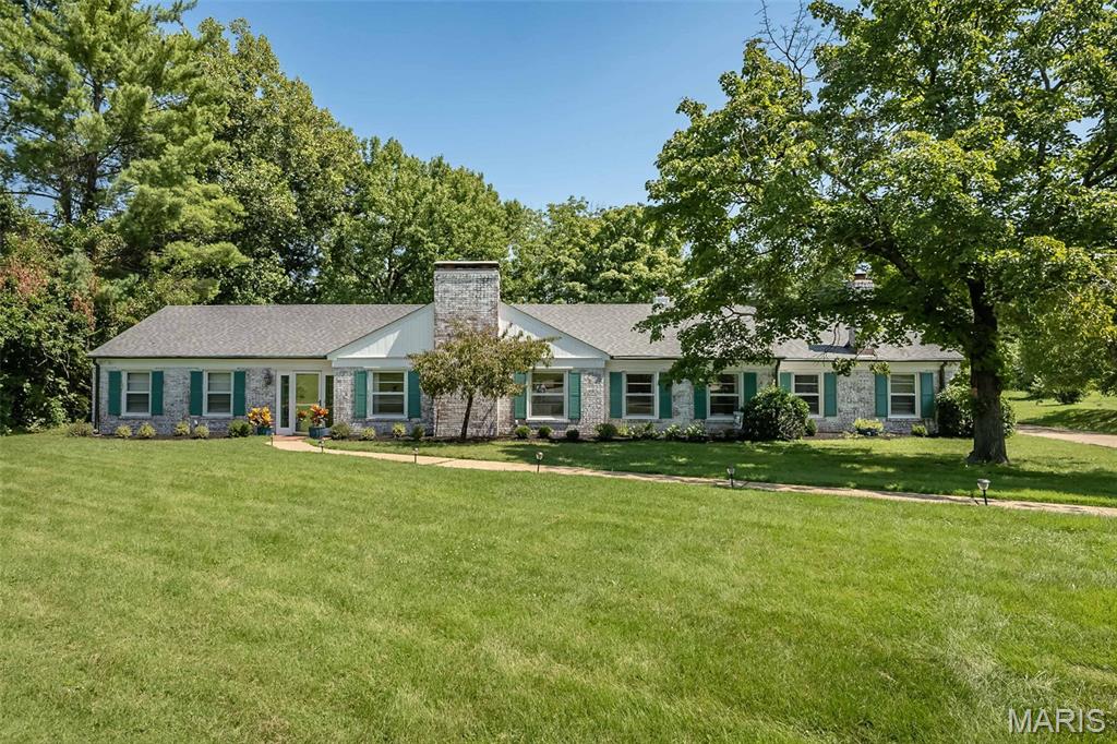 Welcome to 22 Marsally Drive, an exceptionally appointed ranch nestled on approximately 1.52 acres in a private Westwood cul-de-sac. With approximately 3,196 square feet of comfortable one-level living, this inviting home offers 4 bedrooms, 3 full baths, beautiful hardwood floors, and elegant plaster cove moldings throughout.
At the center of the home, the completely remodeled kitchen combines style and function with ceramic flooring, stainless steel appliances, new custom cabinetry, and custom counters. Designed for both daily living and entertaining, it opens seamlessly to a spacious great room featuring custom cabinets, vaulted ceilings, and a fireplace. Together, these spaces create a warm, expansive setting with beautiful backyard views and access to the patio.
The large primary suite provides a peaceful retreat with its own fireplace. In the adjoining primary bathroom, a separate shower and two walk-in closets add comfort and convenience. Three fireplaces throughout the home bring warmth and character to the living spaces in every season.
Outdoor living is just as inviting. Relax or entertain on the covered patio, which flows to an additional spacious brick patio overlooking the expansive backyard.
Situated in the highly regarded Ladue School District, 22 Marsally Drive offers the ease of single-level living along with the space, privacy, and setting that make Westwood so desirable.