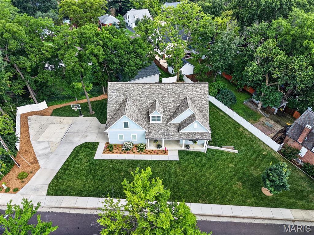 Luxury Living in the Heart of Webster Groves

Offering almost 5,000 square feet of finished living space, modern construction, luxurious amenities, and an unbeatable Webster Groves location, this extraordinary home delivers the perfect combination of elegance, comfort, and convenience. Every detail has been thoughtfully curated, making this a rare opportunity to own a truly exceptional, move-in ready home!

Discover refined living in this exceptional 1.5-story estate, offering almost 5,000 square feet of beautifully finished living space near the heart of Historic Webster!  Built in 2018 and impeccably maintained, this move-in ready home, features 5 bedrooms, 5 bathrooms, and a spacious 2-car garage, Geothermal HVAC and  thoughtfully designed for both elegant entertaining and everyday comfort.

From the moment you arrive, you'll be captivated by the home's striking curb appeal, beautifully landscaped lot, and inviting presence. Inside, an open, light-filled floor plan showcases timeless finishes, Brazilian Cherry Flooring, generous living spaces, and quality craftsmanship throughout.

The luxurious main-floor primary suite serves as a private retreat, offering comfort, sophistication, and convenience. Designed with today's lifestyle in mind, the home's spacious layout provides exceptional flexibility for everyday living, entertaining, and hosting guests.

The recently finished walk-out lower level significantly expands the home's living space with a large recreation and family room, an oversized bedroom, and a full bath—creating the perfect guest suite, private quarters, or additional entertaining space.

Step outside to the expansive maintenance-free deck overlooking the beautiful backyard, where peaceful surroundings provide the ideal backdrop for outdoor dining, relaxing, and gathering with family and friends.

Don't miss out on this one!