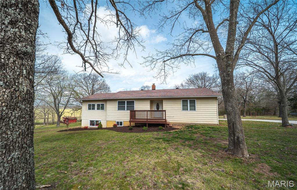 Ten acres of Ozark countryside, all-pavement access, and a covered deck with views that stretch for miles — this is Missouri country living done right. Tucked into the rolling landscape of Maries County, this 3-bedroom, 3-bathroom home delivers the peace and space you've been searching for without giving up a thing in convenience.

Inside, the layout is thoughtfully designed with a spacious primary suite, a well-appointed kitchen with new stainless steel appliances, and a finished basement that flexes as a rec room, home office, or entertaining space. Character and function in equal measure.

What really sets this property apart: it's been updated where it counts. New well pump (2025), new septic system (2024), and a new Culligan double water filtration system with UV light and softener (2025) mean you're moving into a home that's solid from the ground up — no surprises, no projects.
Step outside and the 10 acres open up to endless possibility — hobby farm, room to roam, or simply the kind of quiet that's hard to find. The covered deck is your front-row seat to the Ozarks at their best, morning coffee to golden hour.

Located in the St. James School District, minutes from shopping, dining, and services in town.