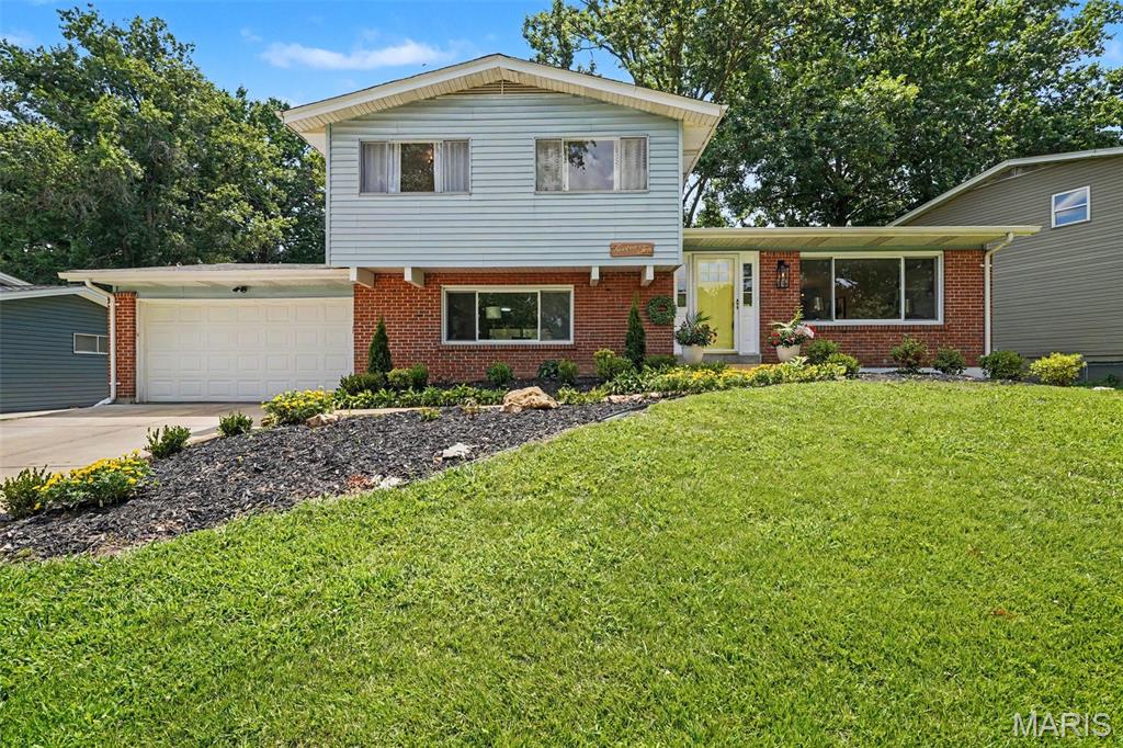 Move right into this beautifully renovated split-level home where every detail has been thoughtfully updated. Featuring an open, light-filled floor plan, this home seamlessly blends modern style with everyday comfort. The stunning kitchen offers custom cabinetry, beautiful countertops, stainless steel appliances and an enormous center island that opens to the main living and dining areas-perfect for entertaining. The spacious primary suite offers a beautifully updated bath, while the additional bedrooms and bathrooms have been tastefully remodeled with today's finishes. Luxury flooring, fresh paint, updated lighting, new trim and designer finishes are throughout the entire home. The finished lower level provides additional living space ideal for a family room! Step outside thru the extra large sliding door to the covered porch, adjoining patio and the large level backyard! Plenty of space in for entertaining and lots of outdoor fun! The additional basement area offers a finished bonus room-perfect for home office or playroom, plus nice storage, laundry room and work bench! So much to love here! Fabulous location! Walk to Queeny park! COMPLETELY RENOVATED FROM TOP TO BOTTOM-JUST UNPACK AND ENJOY!!
