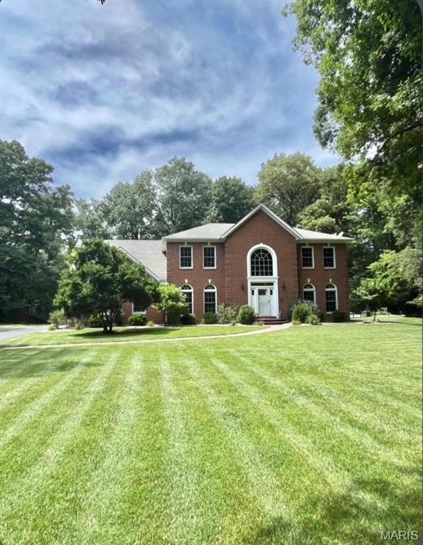 COMING $OQN! Peaceful wooded park like setting just minutes outside of city limits of O'Fallon. This timeless 2 story brick Victorian home sits on 6.6 acres in a small private neighborhood With only 3 other homes and no HOA. Property includes detached garage, large handicap accessible composite deck, fenced in back yard, dedicated in ground pool/outdoor entertainment area, as well as a fenced in garden with raised beds, berry patch, small orchard and room to expand. Inside newer 'Renewal by Anderson' windows provide excellent viewing opportunities of surrounding
nature and local wildlife. Fully finished basement has entertainment space, wet bar, BA, and walkout leading to backyard fire pit and pool area. This home Uniquely offers two primary suites including one on the main floor that's handicap accessible. The second level primary includes expansive seating area and WIC. The spacious suite bathroom includes makeup area, private toilet room, whirlpool soaking tub and rainfall shower. Kitchen features custom cabinets, pull out pantry, double oven, water pot filler, and quartz countertops with a breakfast bar. This property really has it all.