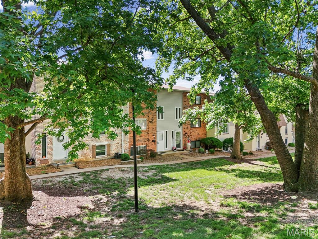 Welcome to this perfectly updated 2 bed/1.5 bath townhouse in Ellisville. Located within walking distance of Bluebird Park, this condo is move in ready with 3 levels of living space. Living room, dining and renovated 1/2 bath are found on main level with newer luxury vinyl plank flooring. The updated kitchen has granite counters, 42" cabinets, stainless appliances & luxury vinyl tile floors.  Upper floor offers 2 bedrooms with primary connected to the full bath with tub/shower combo and solid surface countertop. Bath also opens to hallway for access for 2nd bedroom. Lower level is a walk out w/private fenced patio, a cozy family room with vinyl plank flooring, canned lights and your laundry/storage area. This home has been freshly painted, has new light fixutres &  crown trim accents throughout.  Fantastic location in Rockwood School District close to everything West County has to offer!