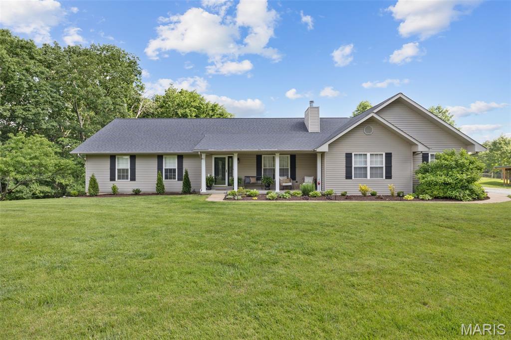Private 18-Acre Estate with Updated Ranch Home, Horse Facilities & Exceptional Outdoor Living

Nestled on 18 picturesque acres in High Ridge, this exceptional property offers the perfect combination of privacy, functionality, and country living—all within convenient reach of St. Louis. Whether you're seeking a hobby farm, equestrian property, recreational retreat, or simply room to roam, this one-of-a-kind estate delivers.

The beautifully maintained ranch-style home features 4 bedrooms, 3 full bathrooms, and more than 3,000 square feet of living space, including a finished walkout lower level. Inside, you'll find hardwood flooring, an open and inviting floor plan, and a spacious great room highlighted by a wood-burning fireplace and expansive windows that showcase the surrounding landscape.

The well-appointed kitchen offers custom cabinetry, granite countertops, stainless steel appliances, pantry storage, a breakfast bar, and an adjoining dining area with peaceful views of the property. The main-floor primary suite features an updated private bath and walk-in closet, while the finished lower level includes a large family room, fourth bedroom, full bathroom, and versatile flex space ideal for a home office, recreation area, or guest quarters.

Additional features include a sunroom, main-floor laundry, and an oversized attached two-car garage with ample workshop and storage space.

Outdoor amenities are equally impressive. The 64' x 30' pole barn is equipped with 100-amp electrical service, lean-to storage, and both 8-foot and 12-foot access doors for equipment and vehicles. Equestrian enthusiasts will appreciate the three oversized horse stalls and abundant space for trailers, tractors, and recreational equipment.

The property is thoughtfully fenced and ready for livestock, featuring approximately 1.5 acres of fenced pasture with durable 4x4 woven-wire sheep fencing and multiple grazing areas. Approximately 7 acres are currently in pasture, with additional acreage available to clear and customize to fit your vision.

Nature lovers will enjoy harvesting fruit from several pear and cherry trees, along with wild blackberry patches. For hunters and outdoor enthusiasts, the acreage supports an abundance of deer and turkey and offers unlimited potential to create a premier recreational property.

This rare offering combines acreage, privacy, modern comfort, and exceptional versatility in a truly remarkable setting. Don't miss the opportunity to own a move-in-ready home surrounded by the beauty and possibilities of 18 stunning acres.