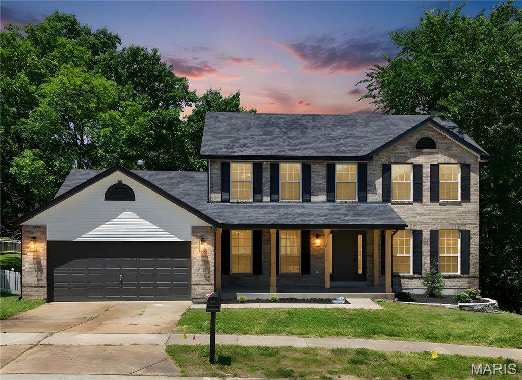 This fully remodeled Ballwin beauty is ready for you to be it's new owner!  Step in this dreamy, sunny home to find a formal living room or office to the right and formal dining room to the left. The open concept kitchen features all new stainless steel appliances, a large eat-in kitchen island, coffee nook, skylights, and luxury tile backsplash.  The kitchen overlooks the family room with a wall of windows and cozy fireplace. Off the kitchen is the most perfect mudroom/laundry room with built-ins to keep leaving and arriving easy and clutter free. The main level is completed with an updated 1/2 bath. Upstairs you will find 4 spacious bedrooms and a fully updated hall bath. The primary bedroom has a walk-in closet and an incredible ensuite bathroom with a shower and a soaking tub that looks out to the woods, as well as double vanities and skylights. The finished walkout basement features a large recreation room, an additional sleeping space and a 3rd full bathroom. The updated exterior includes a new roof, porch pillars and landscaping.  The beautiful back deck overlooks the spacious yard with wooded privacy and access off the kitchen, means using this pace for entertaining is a breeze. Don't miss the chance to own this slice of heaven!
