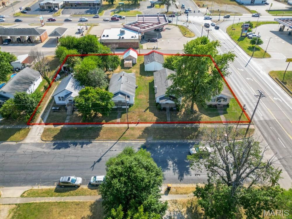 PRIME HIGH-TRAFFIC COMMERCIAL OPPORTUNITY! Here is a rare opportunity to acquire four homes situated together on a strategically located parcel along a busy highway with an impressive traffic count of approximately 7,500 vehicles per day. Offering a unique combination of existing income potential and future development possibilities, this property is ideally suited for investors, developers, or business owners looking for a highly visible location. The existing homes provide an opportunity to generate rental income while planning for the property's future, or the combined footprint could be redeveloped to take advantage of its excellent highway exposure. With strong visibility, convenient access, and a location positioned to capture consistent daily traffic, the property could be well suited for a variety of commercial uses, including retail, office space, service businesses, professional offices, or other commercial ventures, subject to zoning and approvals. Properties offering this type of high-visibility location, substantial land area, and redevelopment potential are increasingly difficult to find. Whether your goal is to add income-producing properties to your investment portfolio or capitalize on the long-term commercial potential of a prime highway location, this property presents an exceptional opportunity with tremendous upside.