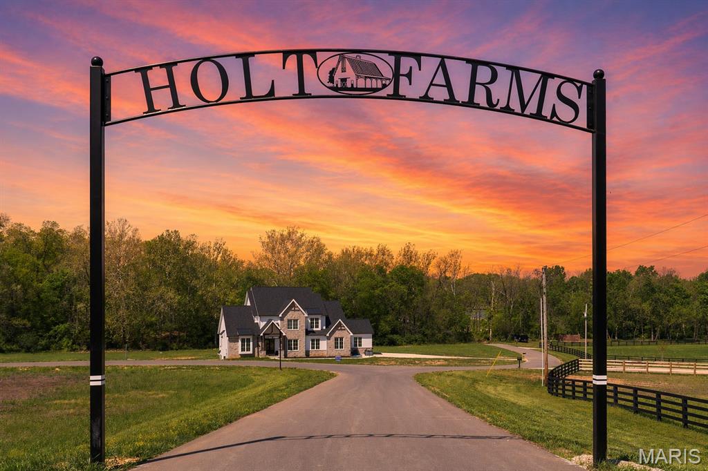 Discover the beauty and tranquility of The Grove at Holt Farms, an exclusive new community featuring stunning 5 acre luxury homesites nestled within one of St. Charles County’s most scenic and historic farm properties.  From gently rolling pastureland to secluded wooded retreats, each homesite offers breathtaking views, peaceful surroundings, and the space to create the lifestyle you’ve always imagined.  Located near New Melle in the highly sought-after AAA-rated Francis Howell School District, The Grove combines quiet country living with everyday convenience — just minutes from Wentzville, Lake St. Louis, and a short drive to the wineries and charm of Augusta wine country.  From the moment you enter and pass over the covered bridge, you'll experience the peaceful beauty and serenity that make The Grove at Holt Farms so special.  This upscale acreage community features paved roads, electric at the street, and the freedom to enjoy country living with horses and outbuildings permitted.  Lot 36 presents a rare opportunity to build your dream home on a heavily wooded 5-acre homesite, surrounded by natural privacy.  Tucked away on a private cul-de-sac, this exceptional property offers the perfect blend of seclusion, serenity, and luxury country living.  Build the custom home you’ve dreamed of with your builder or ours, Griffey Homes, using your plan or one of ours.  Minimum square footage requirements: Ranch: 2,200, 1.5-Story: 2,800, 2-Story: 3,000.  With only 8 exclusive homesites available, this is a rare opportunity to own a beautiful piece of St. Charles County history and enjoy the privacy, serenity, and natural beauty of country living at The Preserve at Holt Farms.  (Tax amount to be determined.)  Listing broker related to seller.  Homesites like this are truly hard to find.