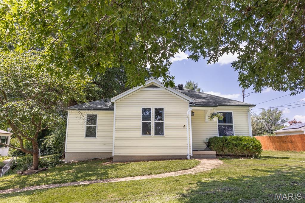 This amazing home has hard wood floors thru-out. Its conveniently located with easy access and has lots of trees for privacy. Nice sized lot includes 10 x 10 storage shed. The living room is generously sized. All bedrooms have wood flooring and nice natural light. The dine in kitchen includes all appliances for your convenience. There is a main floor laundry with a window tucked next to the kitchen. The basement is full and unfinished and ready to made into your dream rooms. The backyard is the place to be, plenty of room for the family to play, has an amazing fire pit for those laid-back nights. If qualified this home can be assumed under a VA loan.