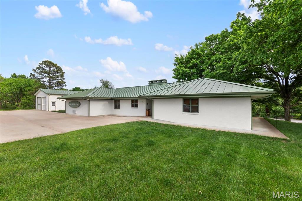 Sitting on 5.5 acres of E. Jackson Blvd frontage, the 2,433 sq ft office building with 30x40 garage/warehouse with two 10x10 doors offers plenty of space for expansion and endless possibilities. There are 3 private offices, large conference room, full kitchen/break room, two bathrooms and full en suite bathroom in main office. With executive style updates throughout, including hardwood floors, stone countertops, stainless appliances, storage area and basement for extra storage, this well-appointed office space also has a large covered patio area outdoors. Location: City, High Traffic, Hwy/Interstate Frntg