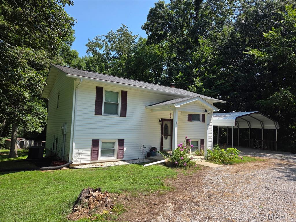 Country living with room for horses! This 3-bedroom, 3-bath split-level home sits back off Illinois Route 13 on 5.96 +/- acres between Marissa and the Tilden T. The mostly wooded acreage offers a private setting with a nice-sized front yard and fenced areas previously used for horses. A newer shed provides both storage and a run-in area for horses, while a chicken coop and additional movable storage buildings add to the property's versatility.
The home features a walkout basement that opens to a patio overlooking raised garden beds and the wooded backyard. A carport is conveniently located next to the home. Whether you're looking for space for horses, chickens, gardening, or simply want more room to enjoy the outdoors, this property offers plenty of possibilities.
Located in the Marissa School District with convenient access to surrounding communities and a manageable commute to Scott Air Force Base or the St. Louis area. A great opportunity to enjoy a peaceful country setting on nearly 6 acres!