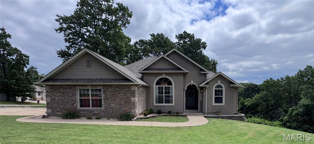 Welcome to this beautifully custom built 5 bedroom 3 bath home in the Shalom Mountain subdivision. From the moment you arrive, you'll appreciate the inviting curb appeal and the amazing interior of this home. Step inside to a welcoming foyer and a desirable split-bedroom floor plan designed for both comfort and privacy. The spacious primary suite is a standout, featuring a versatile bonus room that's perfect for a home office, nursery, sitting area, or workout space, along with four closets offering exceptional storage and newly remodeled bathroom. The living room is warm and inviting with a stunning electric fireplace, while the formal dining room provides the perfect setting for family dinners and entertaining. The thoughtfully designed kitchen offers easy access to both living and dining spaces, making everyday living a breeze. Need more room? The fully finished basement is sure to check off all your wants and needs offering a walk out basement full bathroom workout area and endless possibilities. no need to worry a built-in concrete storm shelter is added peace of mind and a new roof just a year old. Whether you're looking for space to grow or a home you can make your own, this one is full of potential. Schedule your showing today and see why this could be the perfect place to call home!