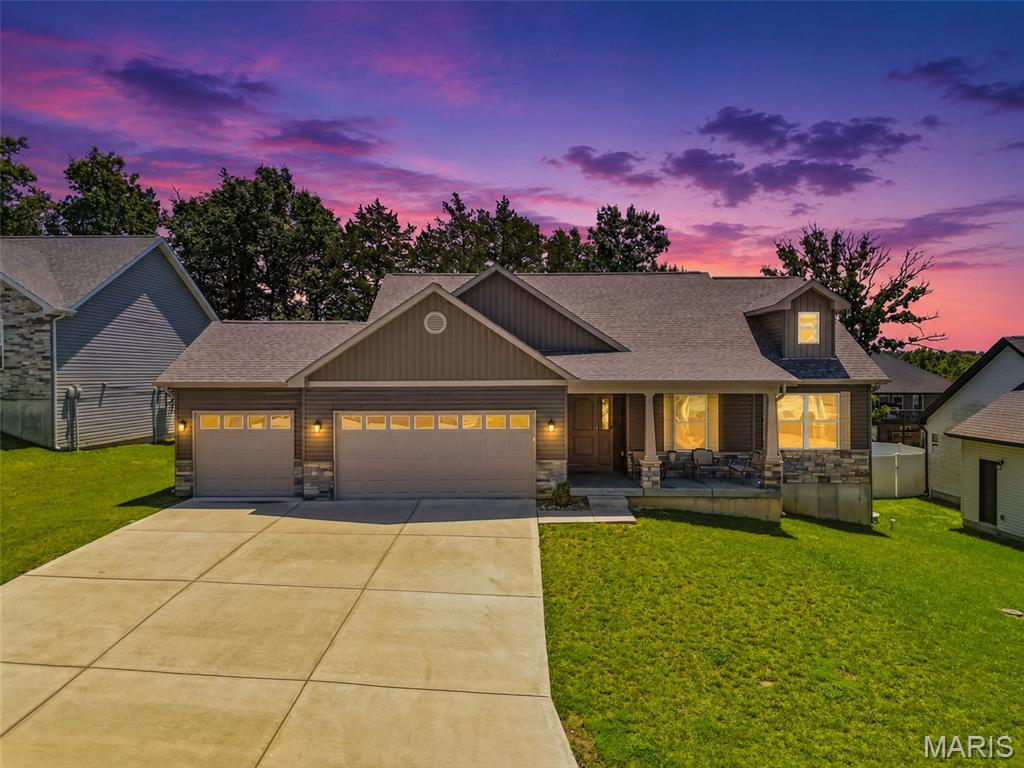 Why settle for one level of luxury when you can have two? At only four years old, this stunning ranch in Auburn Lakes offers exceptional living space on both the main and lower levels. The open-concept design features warm hardwood flooring, granite countertops, custom cabinetry, stainless steel appliances, and a spacious center island perfect for gathering and entertaining.

The private primary suite boasts a spa-inspired bath complete with a soaking tub, walk-in tile shower, his and her sinks, huge walk-in closet, and modern fixtures. Two additional bedrooms, a full bath, and a convenient main-floor laundry room complete the thoughtfully designed split-bedroom floor plan.

The walkout lower level expands the home's versatility with additional living space, a kitchenette, two sleeping areas, and a full bath completely remodeled—ideal for multigenerational living, extended guests, or a private retreat. Luxury vinyl plank flooring and quality finishes create a seamless extension of the home's upscale feel. 

Additional highlights include a 200-amp electrical service, modern mechanical systems, and the peace of mind that comes with a nearly new home. This stunning home offers the perfect blend of style, function, and flexibility.  Don't miss your chance to make 512 Hickory Knoll your new address!