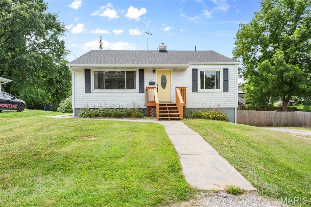 This is the one you've been waiting for! Tucked away on a quiet dead-end street in the Bethalto School District, this beautifully updated 3-bedroom home has that rare combination of character, updates, space and a backyard you'll absolutely love.
From the moment you step inside, the gorgeous refinished hardwood floors set the tone. Fresh paint and an inviting open floor plan create a bright, warm space that feels instantly like home. The layout flows beautifully for everyday living while still giving you plenty of room to gather and entertain.
And there's more downstairs! The walk-out basement adds valuable living space with a family room perfect for cozy movie nights, a playroom, home office or a place to simply spread out.
Then step outside to one of this home's best features — a large, fully privacy-fenced backyard with room for summer get-togethers, a garden or quiet evenings around the fire pit. Add in a one-car attached garage and that hard-to-find dead-end street location, and this home checks so many boxes.
Beautifully updated. Move-in ready. A location you'll love. And a backyard worth getting excited about.  310 Kenny Street is one you won't want to miss.