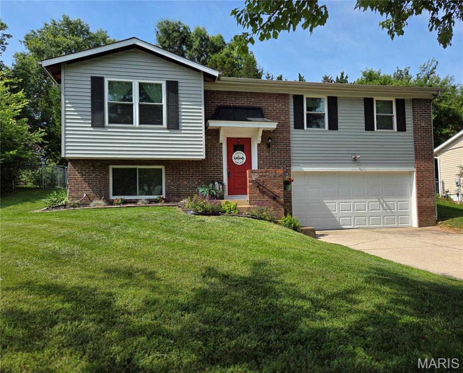 Come see this Adorable Fenton home located in desired Rockwood School District.  A Great opportunity in a Great Location near shopping, schools and major highway. The subdivision offers sidewalks and streetlights perfect for an evening stroll.  This home features 4 bedroom generous in size and 2 full bathrooms with an oversized 2 car garage.  Other features are fresh paint throughout as well as beautiful hardwood flooring, a spacious dining room and kitchen island with extra storage, a brand new mounted microwave, lazy susan cabinet, as well as a kitchen pantry.   Just off the dining room is the backyard entrance just awaiting the new owners touch for a large patio or deck to make it your own special outdoor entertaining space.  The lower level 4th bedroom can also be turned into a second living room,  game room or office space. The back yard is very large and is fully fenced with an access gate.  New Siding/Shutter 2017, New Windows Throughout 2017, Kitchen Cabinets and Granite Island new in 2017, Lower Level Tiled Shower New in 2017, New 6 Panel Doors and Trim 2026, Fully Renovated Main Level bath dual sink vanity 2024.  Schedule your appointment TODAY!!  Showings Start Friday 6/26/2026.