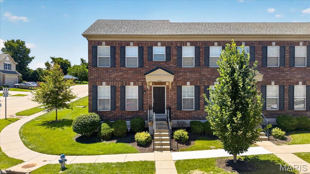 Wonderful and well-maintained end-unit townhouse in a highly desirable St. Peters location! This 2-bedroom, 1.5-bath home offers a functional floor plan with abundant natural light and additional green space thanks to its corner location. The spacious living room opens to the entry foyer and staircase leading to an upper-level sitting area, perfect for a home office, reading nook, or flex space. The kitchen features custom cabinetry with pull-out drawers, a pantry, double sink, and all appliances included. The kitchen/dining room combo makes it effortless to entertain. The unfinished lower level provides excellent storage, a private laundry area, and future finishing potential. Upstairs, the primary bedroom features a walk-in closet and private access to the hall bath, while the secondary bedroom also offers a walk-in closet. Additional highlights include all-electric utilities, a detached 2-car garage with an opener, ample guest parking, low monthly HOA fees, and attractive brick and vinyl exterior finishes. Conveniently located near Highway 94, Page Extension, shopping, dining, parks, the Rec-Plex, and more, this move-in-ready home offers low-maintenance living in a fantastic St. Peters location.