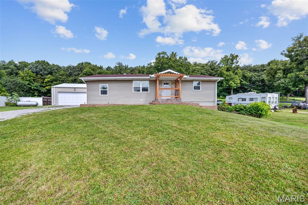 Prime Country Living Just Minutes From Town!
Welcome to your ideal country retreat! Situated on 1 serene acre just outside Potosi, this spacious home offers the perfect balance of peaceful living and everyday convenience, located only a short drive to local schools and downtown. Inside, the main level features a bright, open floor plan connecting your living spaces, along with 3 comfortable bedrooms and a full bath. Step off the kitchen onto an impressive, large stamped concrete patio—the ultimate setup for outdoor dining, entertaining, or simply relaxing while overlooking your spacious backyard. The partially finished basement dramatically expands your living area with a generous family room, an additional sleeping area, a second bathroom, and a dedicated laundry room. A convenient side walk-out provides seamless outdoor access. Car enthusiasts and hobbyists will love the 24x24 detached 2-car garage equipped with a concrete floor. Don't miss this complete package—schedule your showing today!
